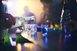 © peopleimages.com - Barman, spirits and pour alcohol in night club for service, order and counter server with hospitality. Bartender, employee and prepare drink in glass at social event, happy hour and serving liquor