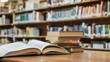 © The Little Hut - Book stack and opened book on the desk on blurred bookshelves in light public library room background : Generative AI