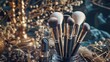 © Awais - A set of makeup brushes with black handles and brown bristles, arranged on a stone surface decorated with brown and cream-colored dried plants.