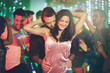 © peopleimages.com - Couple, love and dance in club at night on date with romance in marriage or relationship. People, celebrate and embrace together with happiness at disco, party or rave at techno music with freedom