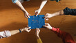 © Summit Art Creations - Top down view of skilled business people assemble blue jigsaw puzzle on meeting table. Group of diverse team working together to solve the puzzle. Represented togetherness, cooperative. Convocation.