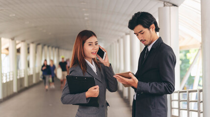 Sticker - Group of Asian business people diversity talking meeting outside office. Multiethnic teamwork collaboration team meeting. Business people shaking hands together diversity multiethnic Business partner