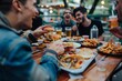 © SHI - A diverse group of friends dine at an outdoor cafe, enjoying burgers and drinking beer together.