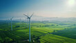 © TK - Studio - A large field of wind turbines with a clear blue sky in the background