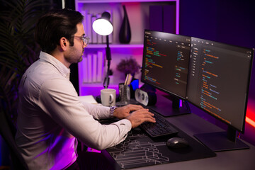 working smart it developer analyzing data software development on two pc screen, creating applicatio