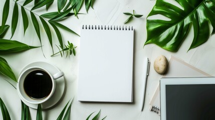 Wall Mural - Modern Home Office Workspace with Spiral Notebook, Tablet, Coffee Cup, and Green Plant Top View.