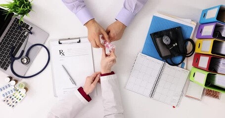 Sticker - Cardiologist and patient discuss medications in clinic, top view