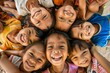 © Inigo - Group of happy smiling asian kids on the beach, top view