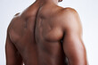 © peopleimages.com - African man, back and fitness for weight loss, detox and body goals or target isolated in studio. Male person, sports and bodybuilder for nutrition, healthy diet and wellness with training or workout