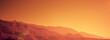 © vvvita - Silhouette of mountains against the orange sunset sky. Horizontal banner