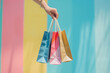 © barmaleeva - Hand holds lots of shopping bags