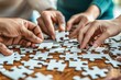 © Sandu - Several people assembling puzzle table