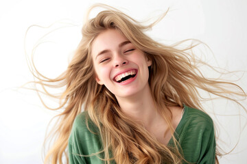 Sticker - Portrait of blonde woman with long hair laughing and smiling, wearing green top isolated on white background