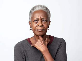 Wall Mural - White background sad black american independant powerful Woman realistic person portrait of older mid aged person beautiful bad mood expression Isolated on Background racism