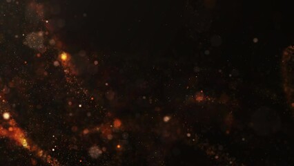 Poster - Small blurred orange particles on a black background.