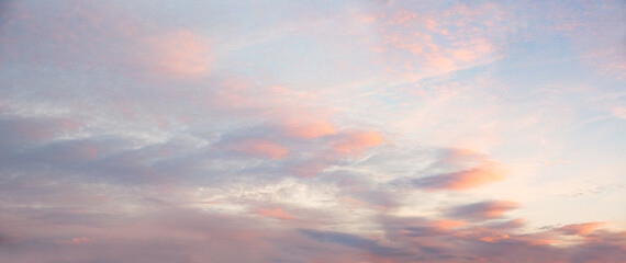 sunset sky panorama with soft light pink clouds