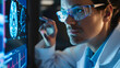© john - Scientist in glasses looking at screen with medical brain data