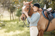 © peopleimages.com - Woman, horse and happy in portrait in farm for ride with care, love and hobby in California. Female person, countryside and smile in forest for adventure, fun and relax on break for activity as rider