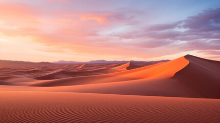 panoramic sunset over desert sand dunes.