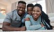 © peopleimages.com - Portrait, black family and happy in house on floor for bonding, love and support with care. People, smile and together with confidence or laugh in living to relax, chill and fun on day off with trust