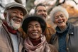 © Inigo - Group of senior friends having fun outdoors in the park. They are smiling and looking at camera.