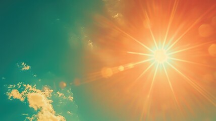 Wall Mural - bright sun shining with lens flare against clear blue sky some clouds
