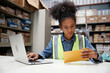 © offsuperphoto - factory worker reading and looking at envelope in the office or warehouse storage
