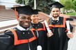 © Serhii - Diverse international students with diplomas attending graduation ceremony, happy multiracial group of students