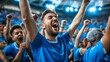 © SerPhoto - A group of young fans in blue T-shirts rejoice at their team's success.