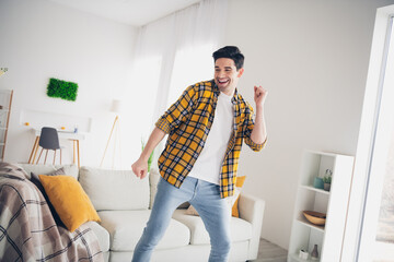 Poster - Photo of cheerful positive guy dressed plaid shirt enjoying weekend having fun indoors room home house