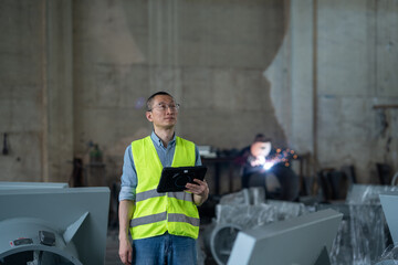 Wall Mural - person working with tablet in workshop