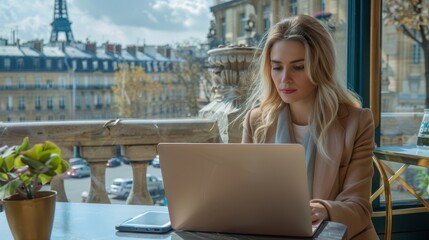 Woman working on a laptop at a Parisian café, perfect for lifestyle, travel, and remote work content.