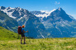 © Kotangens - Sporty woman hiking in Switzerland alps. Heathy lifestyle, sport, beauty in nature. Grindelwald valley, Swizz