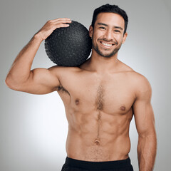 Poster - Fitness, medicine ball and portrait of shirtless man in studio on gray background for health or hydration. Body, exercise and smile with happy or strong sports person at gym for training or workout