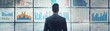 © djmaxx24 - A business man stands in front of the whiteboard with charts and graphs, while he is looking at it from behind his back. The background shows several sheets on which different financial data are displ