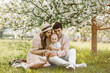 © annaartday - Beautiful mother and daughter in hat with father on picnic