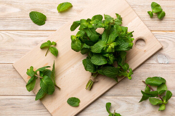 Wall Mural - Fresh mint on Cutting board table, top view. Flat lay Space for text