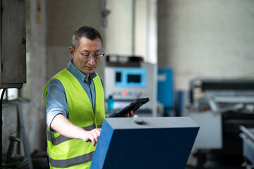 Wall Mural - person working with tablet in workshop