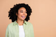 © deagreez - Photo of nice young lady look empty space wear green shirt isolated on beige color background