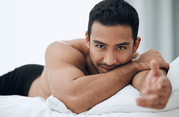 Poster - Happy, man and hand for welcome to bed in morning with blankets and pillows for romance or intimacy at home. Asian male person and model with smile, confidence and sexy greeting or gesture in bedroom