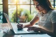 © AIGen - Class Training. Young Woman Taking Online Course, Writing Notes on Laptop for Employee Education
