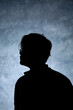 © Harris Kharisma - side view body silhouette portrait of a man on a dark abstract background