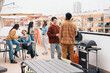© Santi Nuñez/Stocksy - Rooftop Social Gathering BBQ