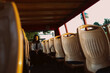 © Anna Malkova/Stocksy - a young girl sitting alone in the back row of seats on a bus.