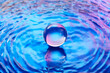 © Yaroslav Danylchenko/Stocksy - Crystal ball standing in water with holographic gradient