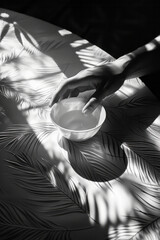 Aufkleber - A scene of a hand-held lens focusing sunlight into a bright point on a piece of paper, casting complex shadows around it,