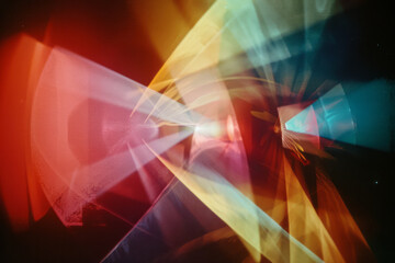 Poster - A lens projecting a cone of light that splits into a spectrum of colors, each forming unique abstract shapes,