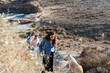 © Raul Navarro/Stocksy - Coastal Walk with Friends and Dog