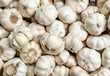 © Tim Booth/Stocksy - A pile or garlic bulbs