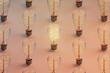 © Giada Canu/Stocksy - Wide-Angle View of Edison Bulbs in Repetitive Pattern